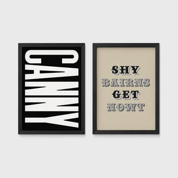 Set of 2 framed prints, Newcastle & Geordie dialect prints (black & white): the word "Canny" in bold black and white type; and the Geordie slogan "Shy Bairns Get Nowt" in bold black and white type — unframed