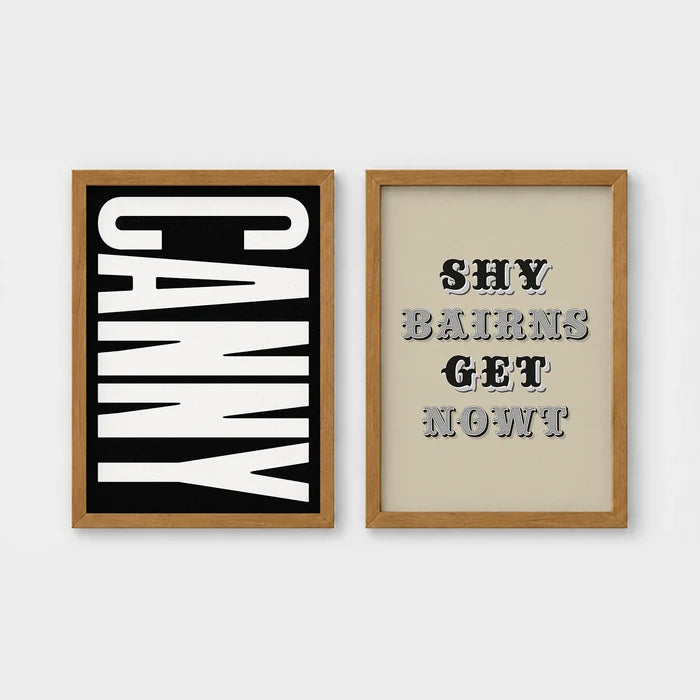 Set of 2 framed prints, Newcastle & Geordie dialect prints (black & white): the word "Canny" in bold black and white type; and the Geordie slogan "Shy Bairns Get Nowt" in bold black and white type — unframed