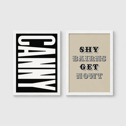Set of 2 framed prints, Newcastle & Geordie dialect prints (black & white): the word "Canny" in bold black and white type; and the Geordie slogan "Shy Bairns Get Nowt" in bold black and white type — unframed