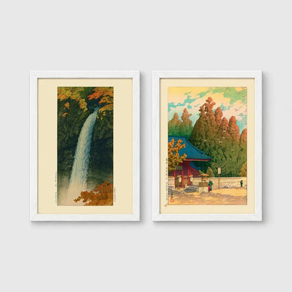 Set of 2 framed prints, Kawase Hasui Japanese woodblock prints: a waterfall cascading through autumn foliage; and a red pagoda gate in an autumn forest — unframed
