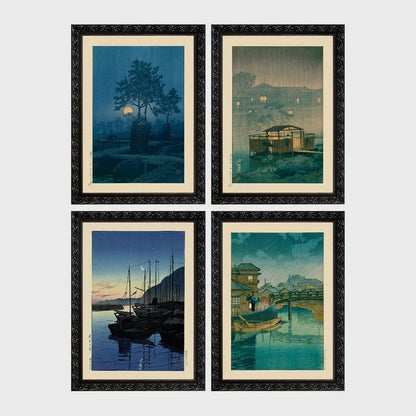Set of 4 framed prints, Kawase Hasui Japanese woodblock prints (night scenes): a moonlit tree and stone lantern at night; a misty rain-soaked house with lantern light at dusk; sailboats moored at a harbour at dawn; and a canal bridge scene with a figure and umbrella at twilight — unframed