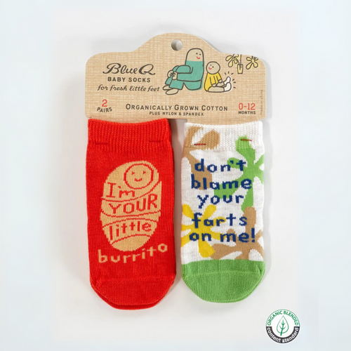 Two baby socks with humorous text on a BlueQ branded card against a white background.