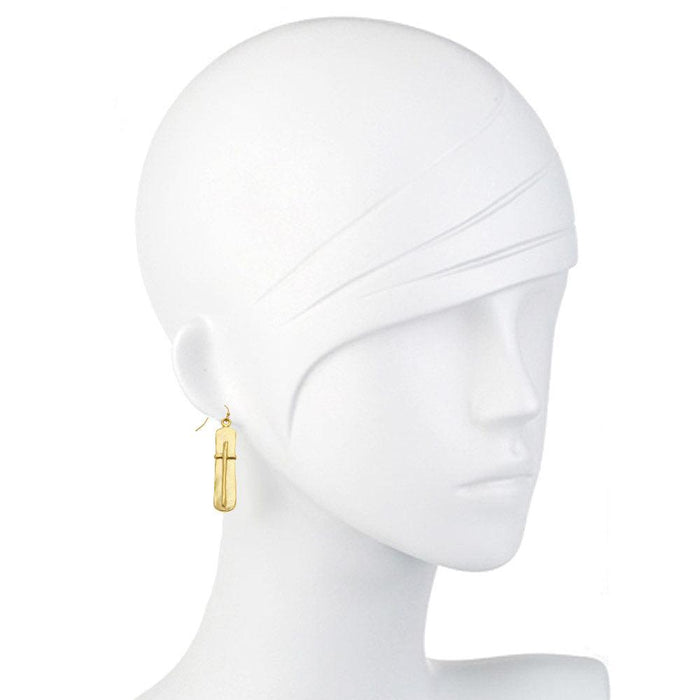 Gold cross earrings on a mannequin, showcasing the design detail.