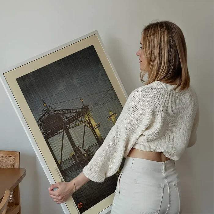 Shinohashi Bridge Print by Hasui Kawase held up against a living room wall