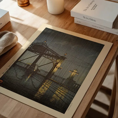 Shinohashi Bridge Print by Hasui Kawase, Japanese woodblock print unframed on a home office desk