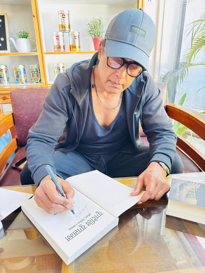 Rajesh Hamal Signing the Book Yug Dekhi Yug Samma for his readers in USA
